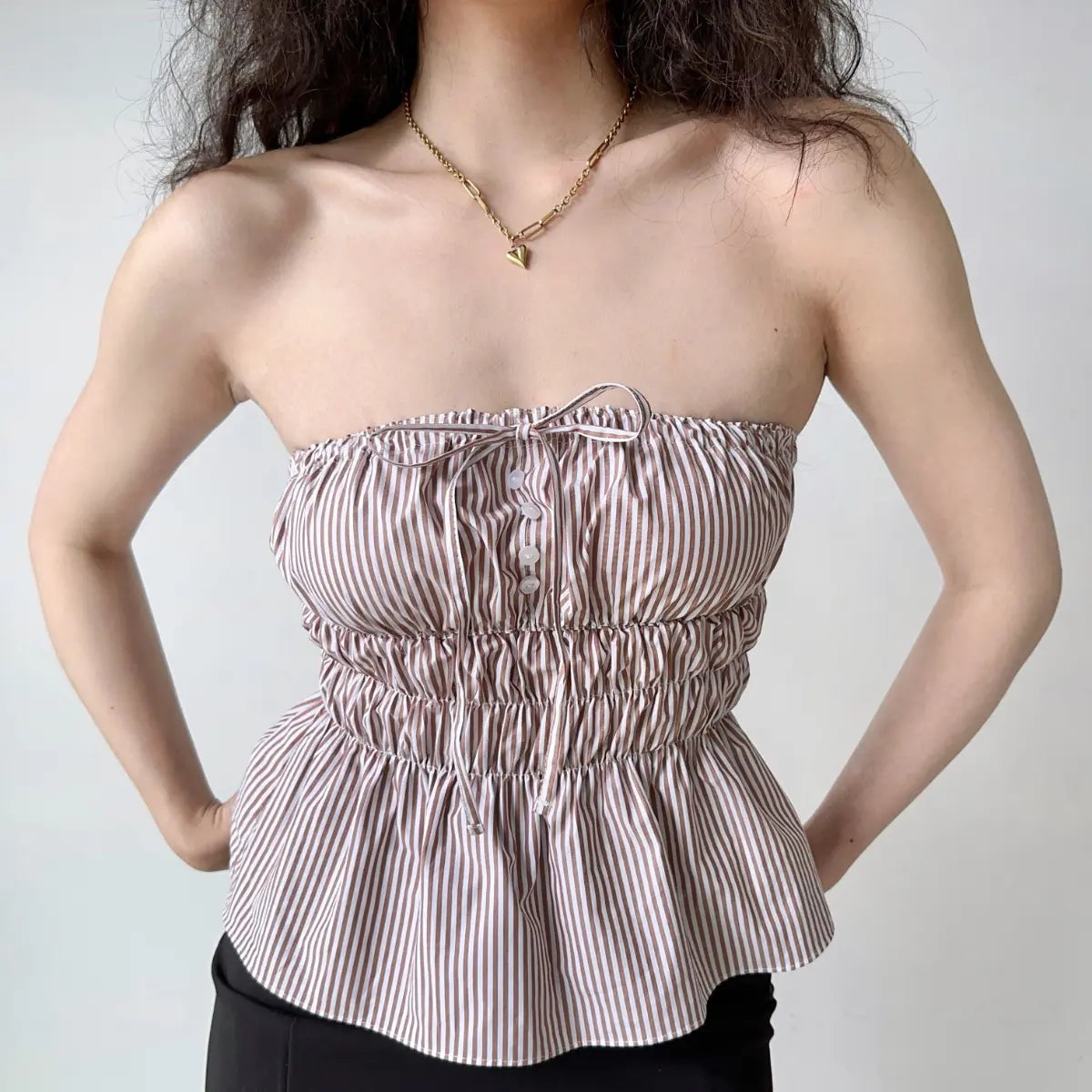 Full front view of lavender peplum bandeau top