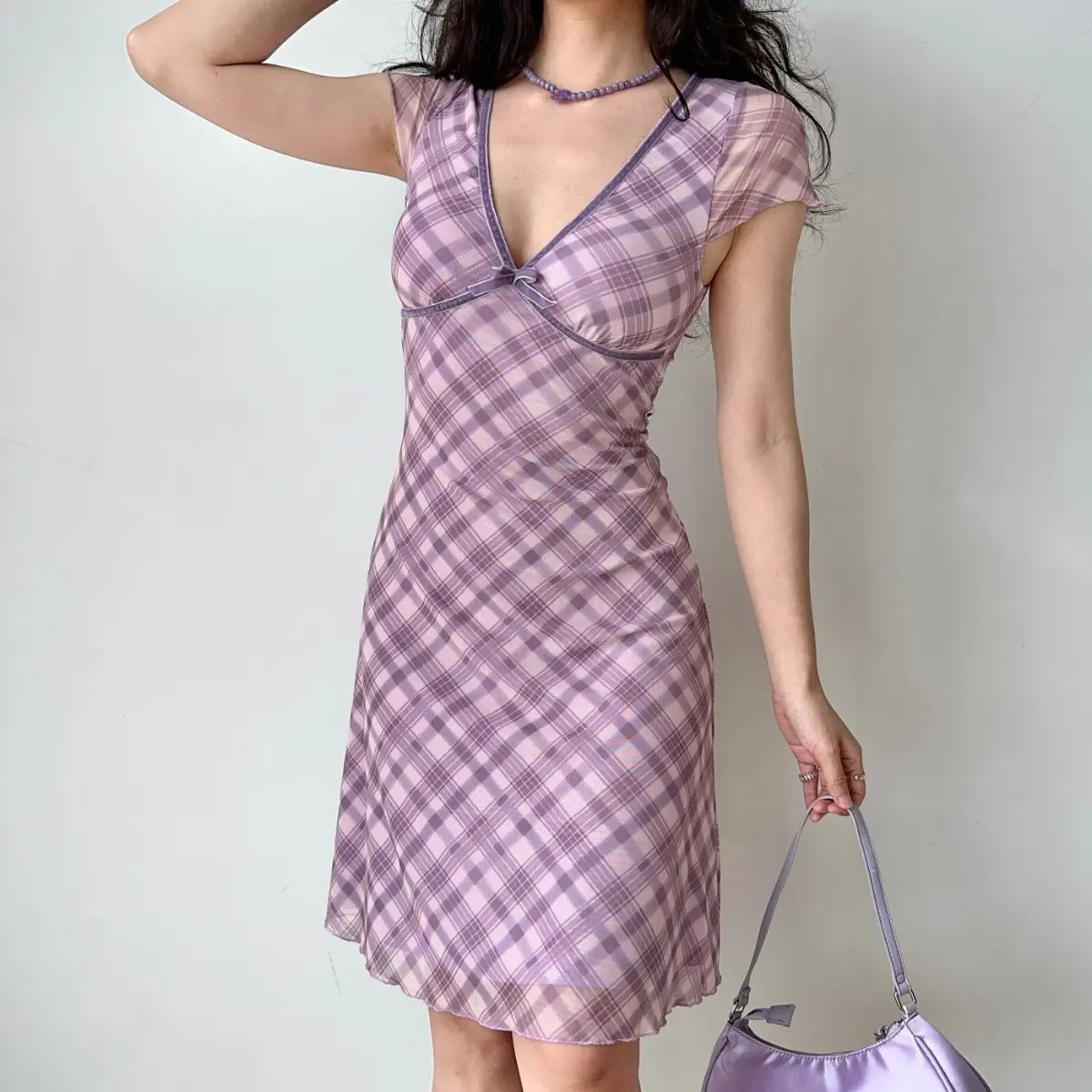 Lavender plaid dress showing mesh fabric and hem flow