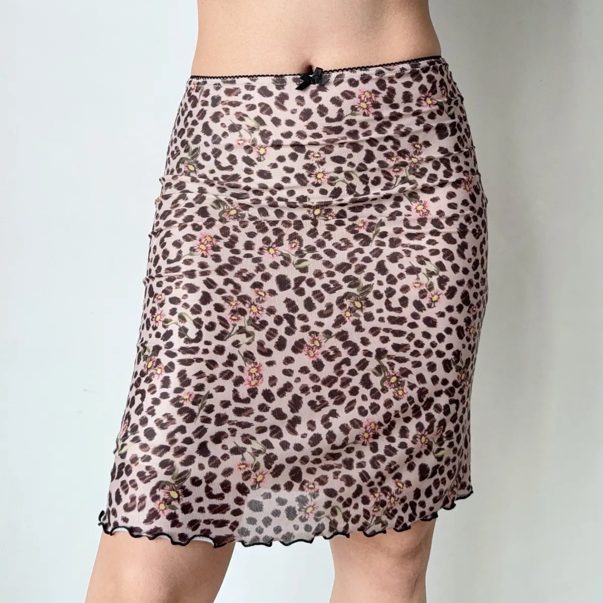 Close-up of model wearing leopard floral mesh midi skirt