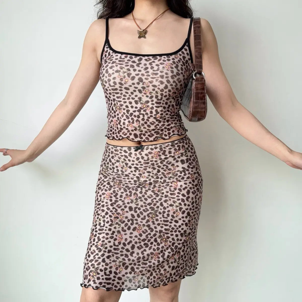 Model wearing leopard floral mesh cami and midi skirt set, full front view