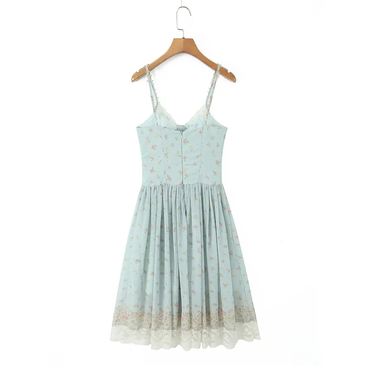 Hanger back view of light blue floral cami dress with spaghetti straps and tiered skirt design