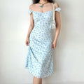 Light blue floral dress styled with a white bag