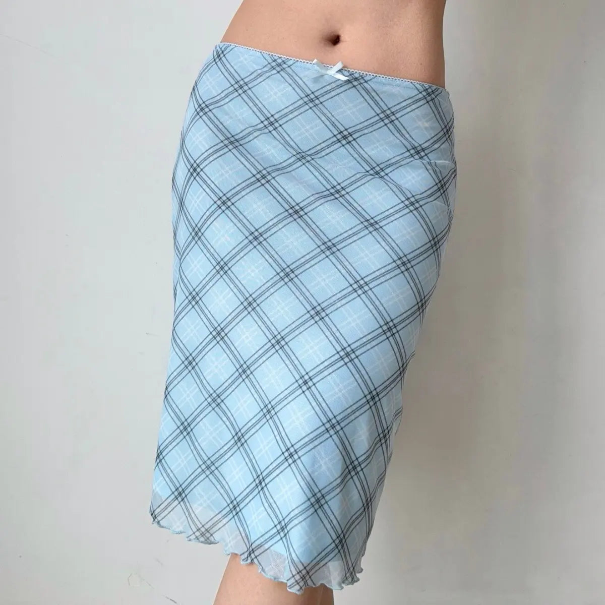 Side view of light blue plaid mesh skirt