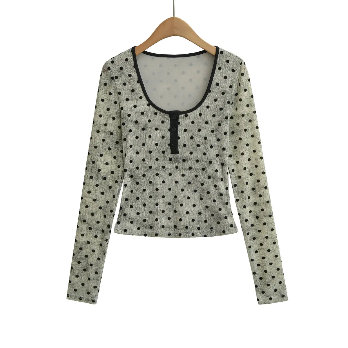 Light gray polka dot Henley long sleeve top on wooden hanger