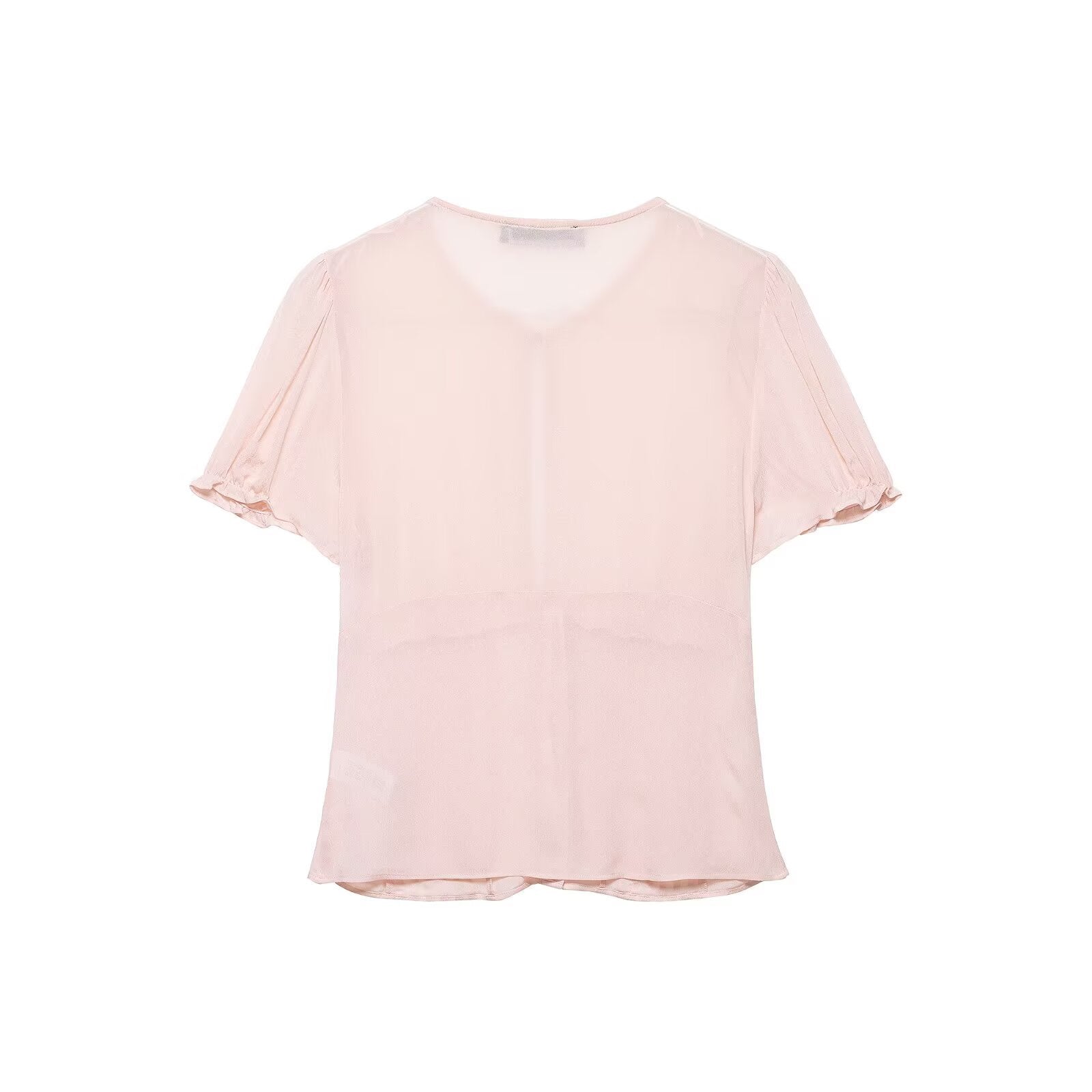 Back view of light pink puff-sleeve blouse with solid color back and fitted silhouette