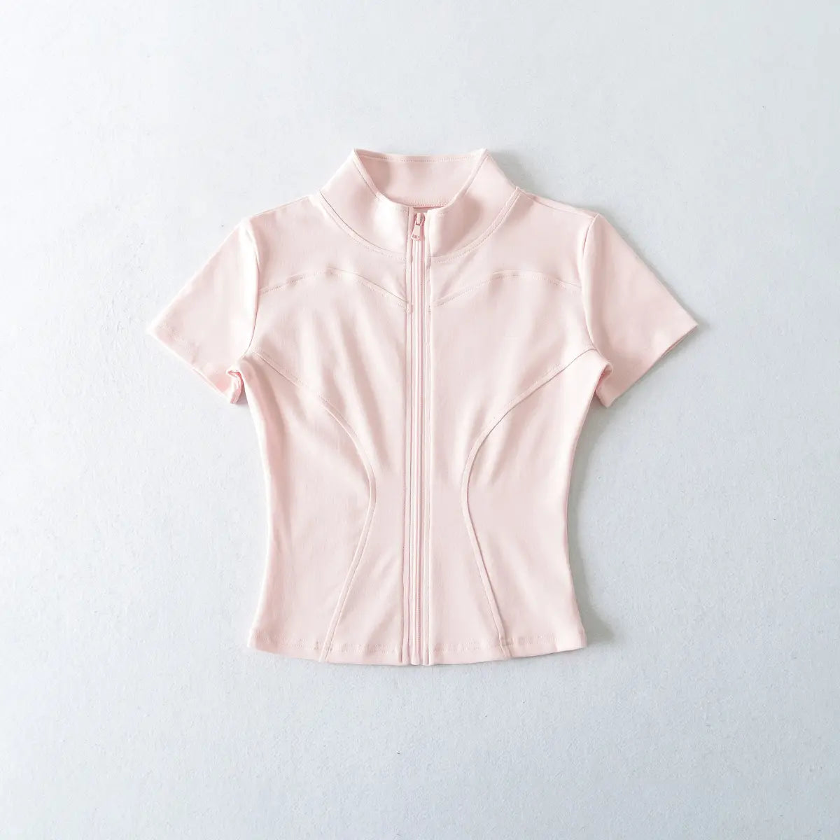 Front view of light pink zip-up cropped t-shirt