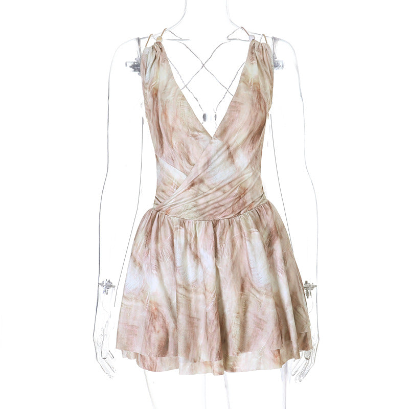 Front view on round mannequin of neutral beige marble tie dye print deep v neck thin strap high waist flared hem mini dress, elegant chic party outfit