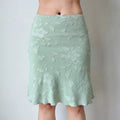 Full front view of mint green floral jacquard skirt