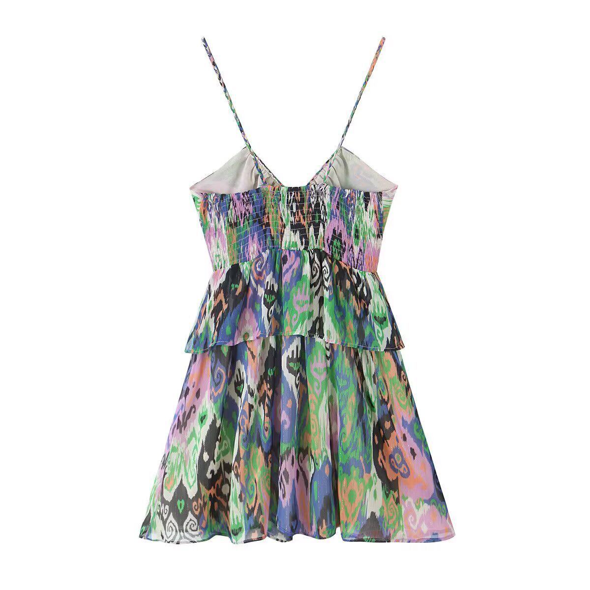 Back view of multicolor paisley print cami mini dress with tiered silhouette and V-shaped back