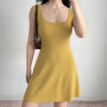 Model wearing mustard yellow square-neck knit cami dress, ribbed bodycon summer mini dress