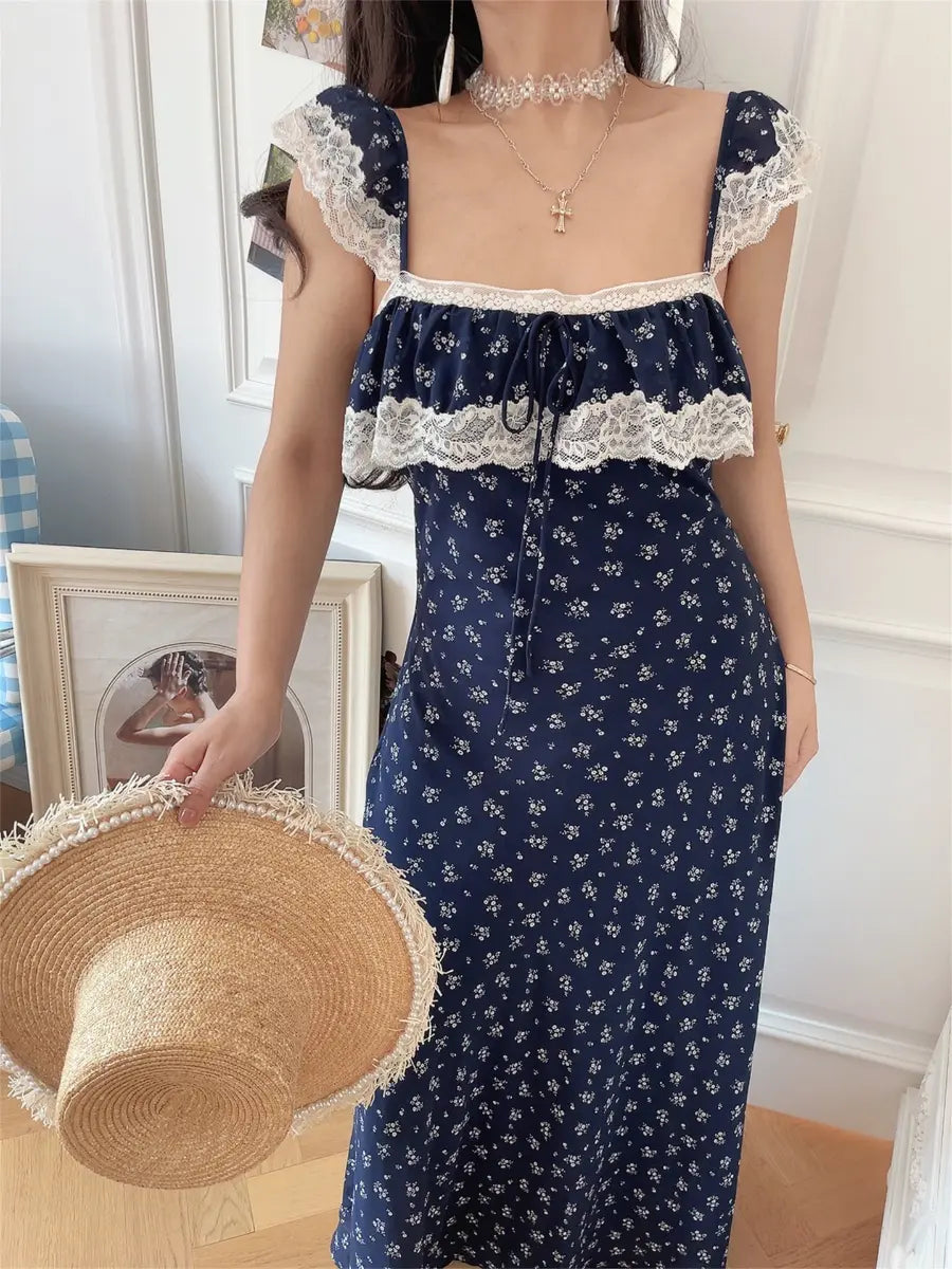 Model in navy ditsy floral lace-trim maxi dress, front view