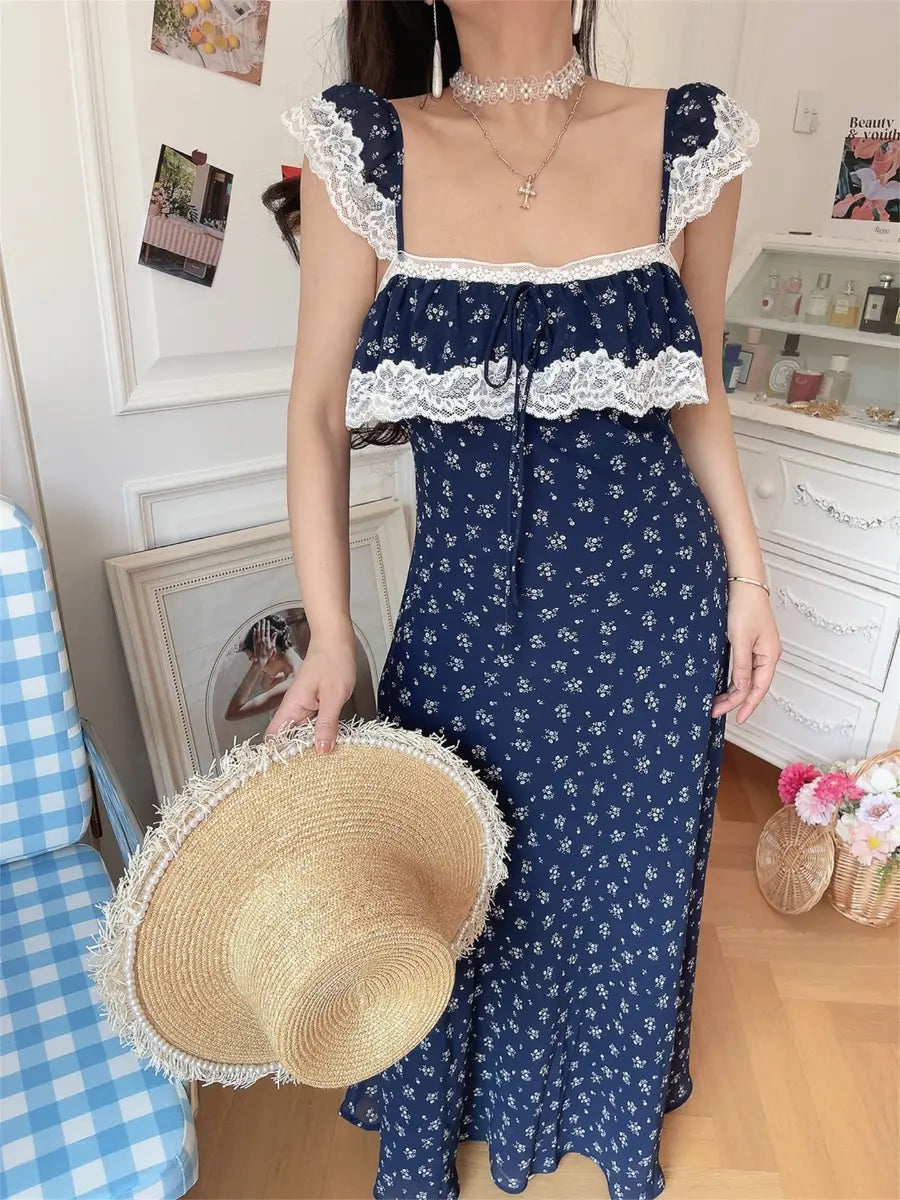 Side view of navy ditsy floral lace-trim maxi dress on model