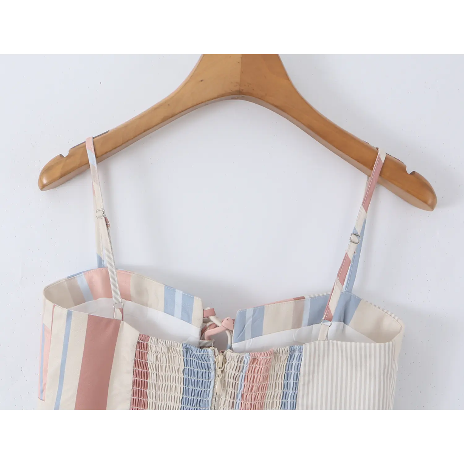 Hanging back waist full view, two-tone striped adjustable straps, full horizontal elastic smocked back panel, cropped separate top