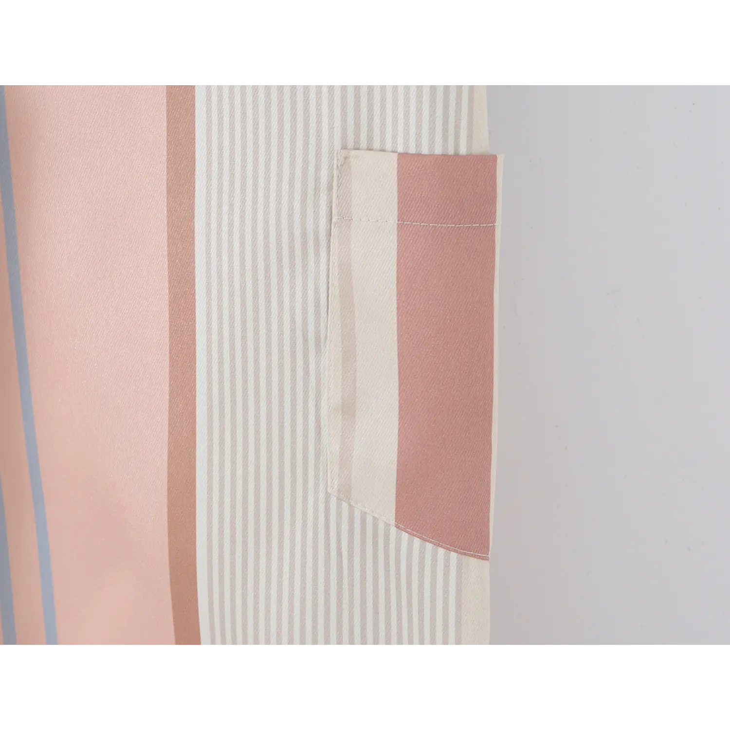 Side cargo patch pocket close-up, self-fabric striped panel, double straight topstitch edge finish
