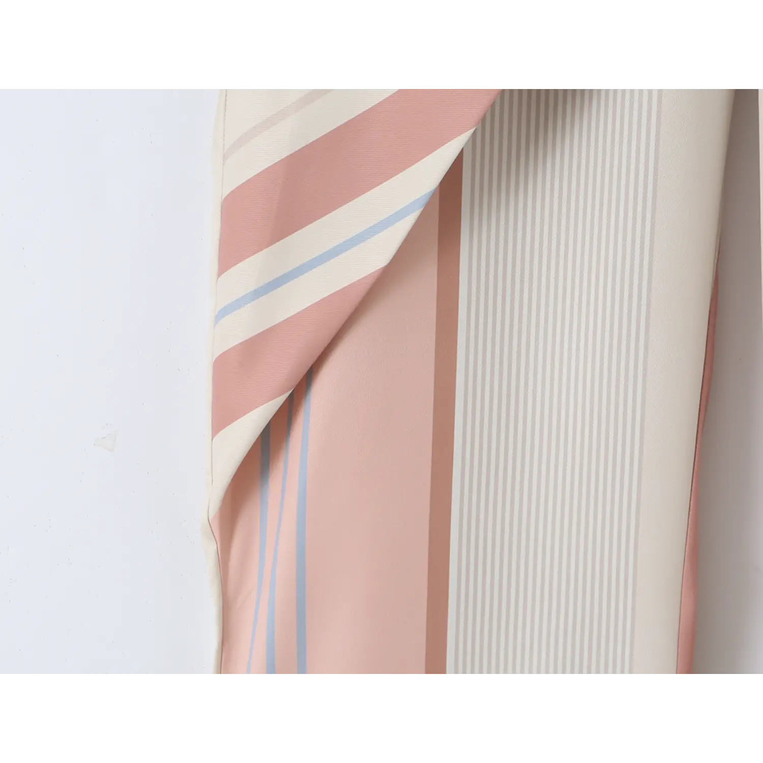 Side cargo patch pocket close-up, fully lined matching striped fabric with double edge stitching