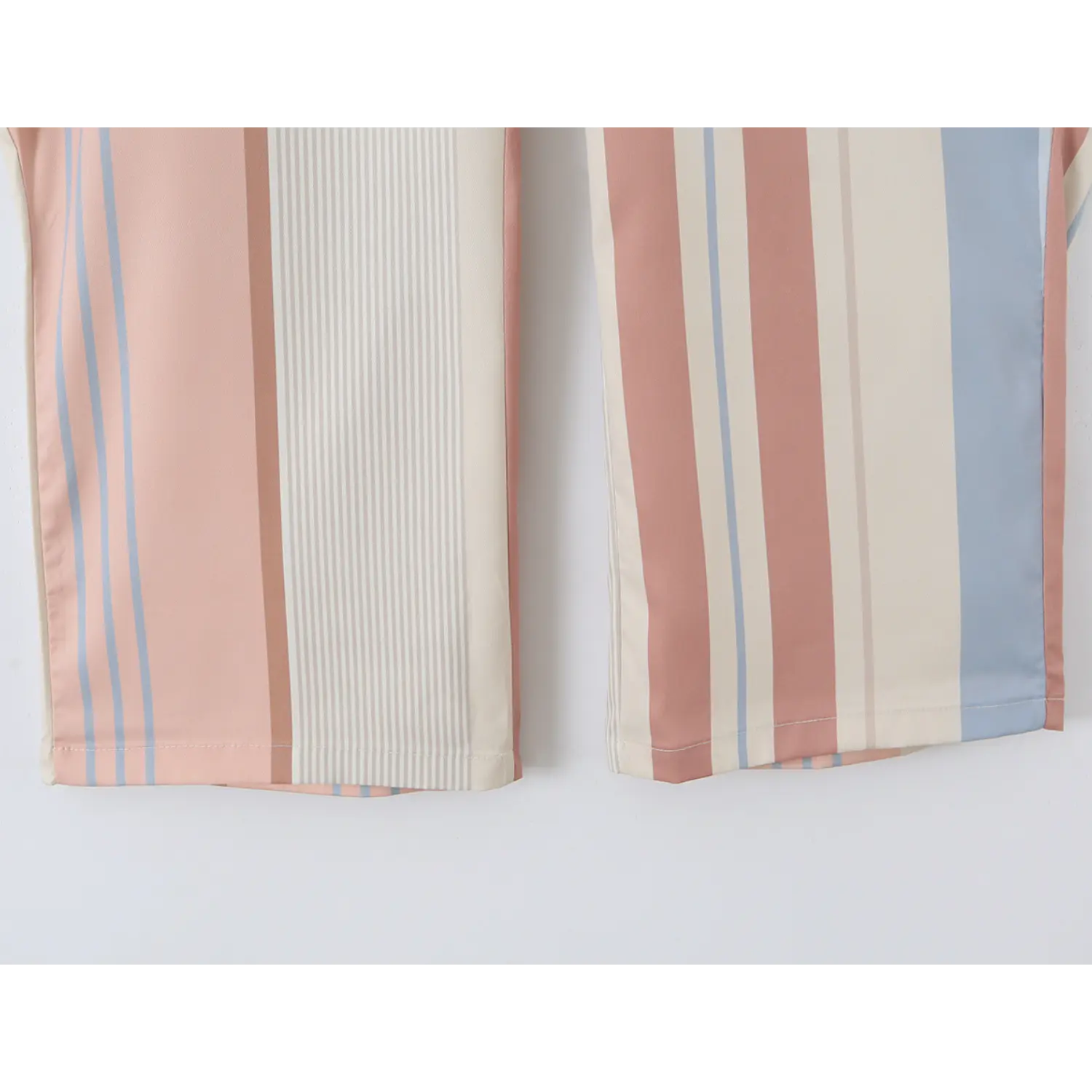 Pant leg bottom hem neat double straight stitching, vertical neutral pastel stripe fabric soft drape texture