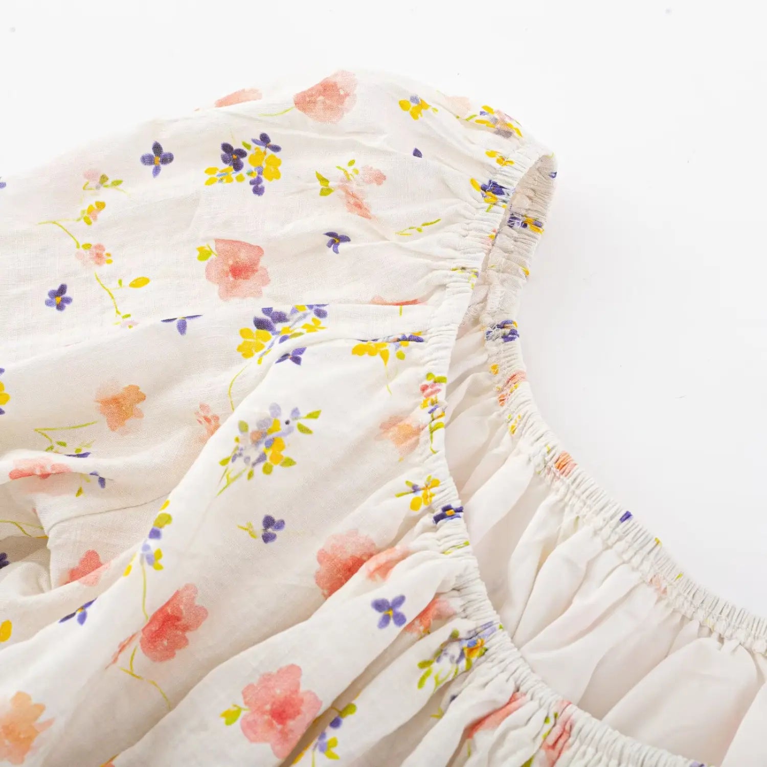 Inner lining macro shot, neck elastic band serged stitching, lightweight crinkled woven material
