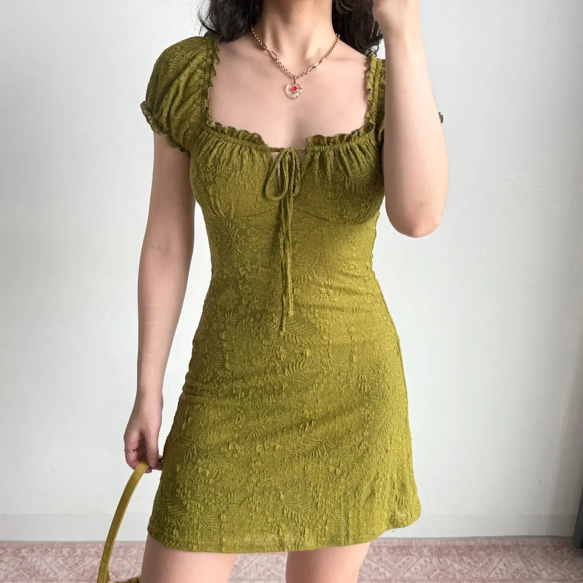 Full front view of olive green textured mini dress
