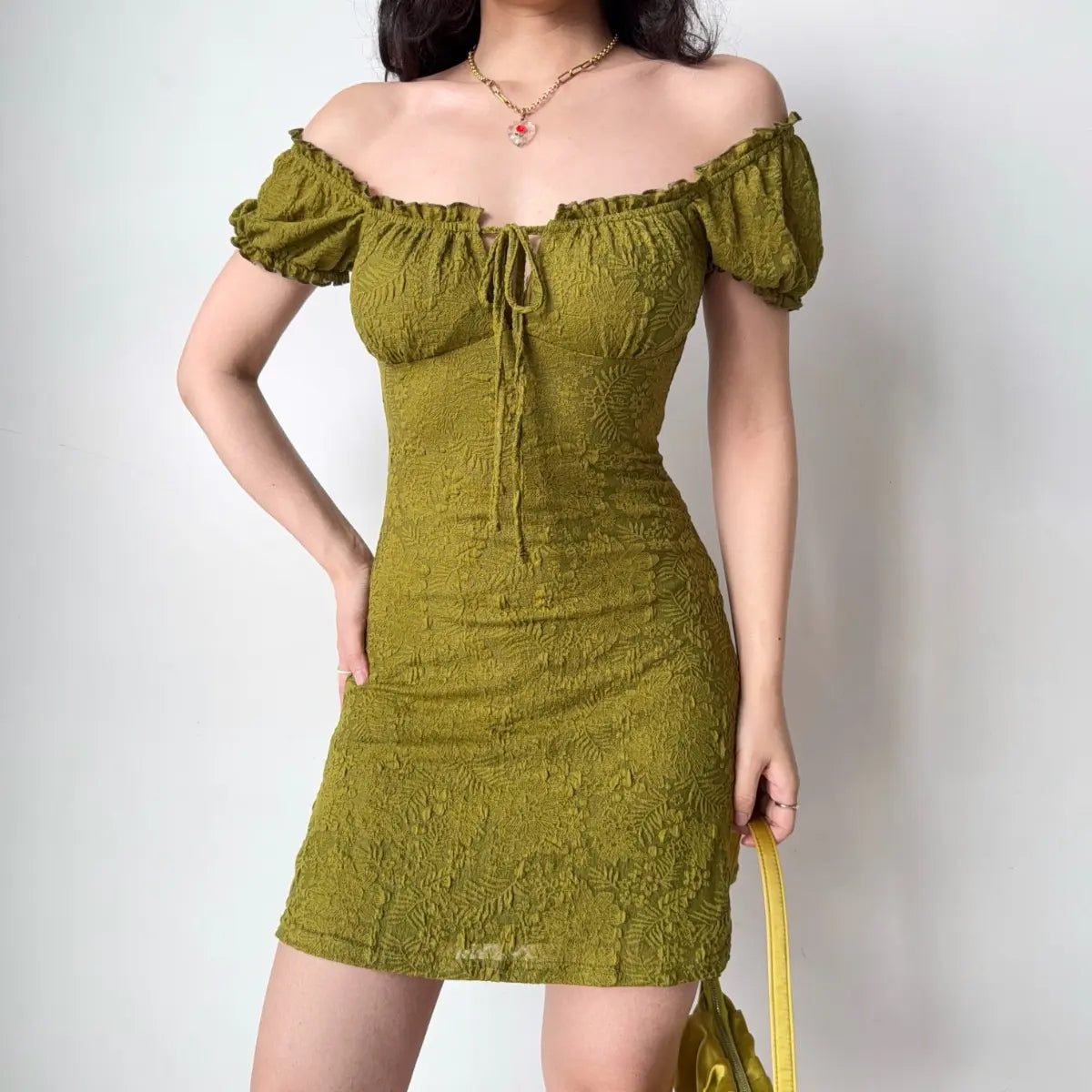Olive green dress styled as off-the-shoulder