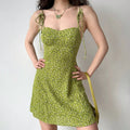 Olive green floral mini dress, hands on hips pose