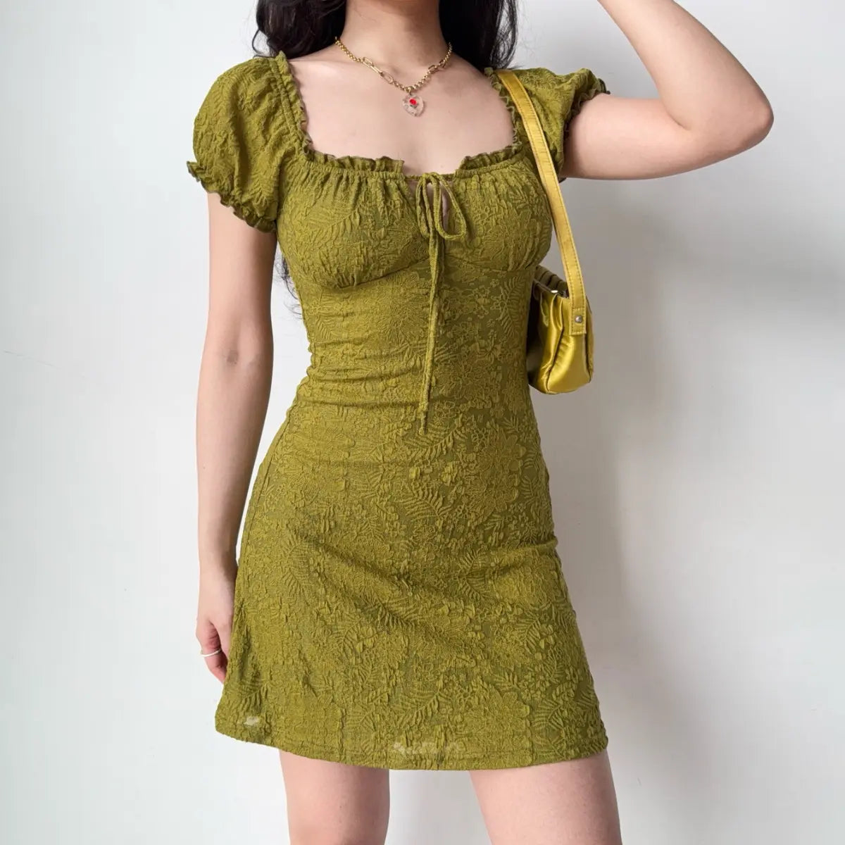 Olive green textured mini dress with puff sleeves