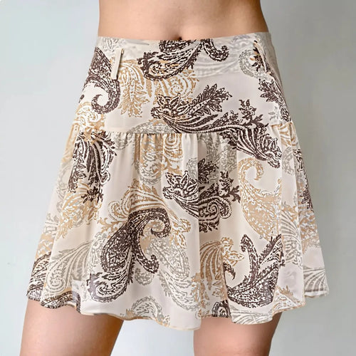 Model wearing beige paisley print ruffled mini skirt