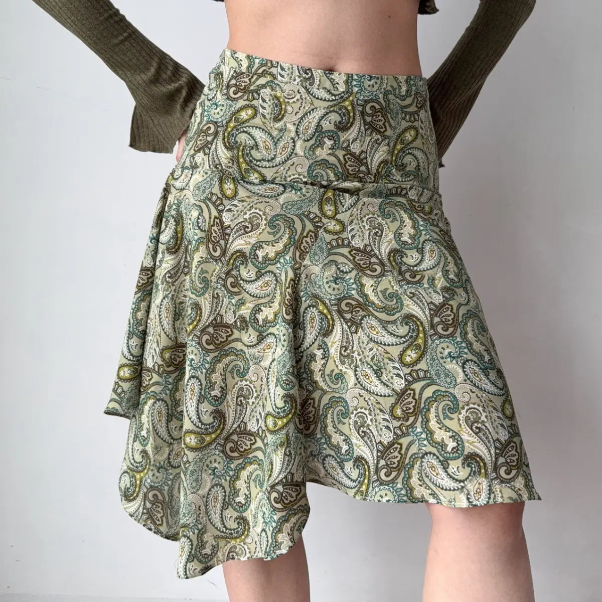 Side view of paisley print asymmetrical skirt