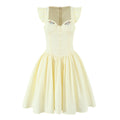 Front view of pale yellow corset-style mini dress with floral embroidery, button front and A-line skirt