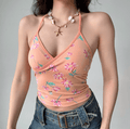 Close up front view peach orange floral halter V neck wrap ruched crop cami top, slim fitted casual vintage beach camisole