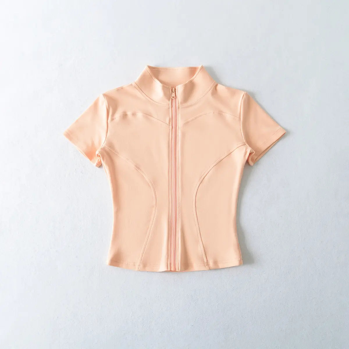 Front view of peach zip-up cropped t-shirt