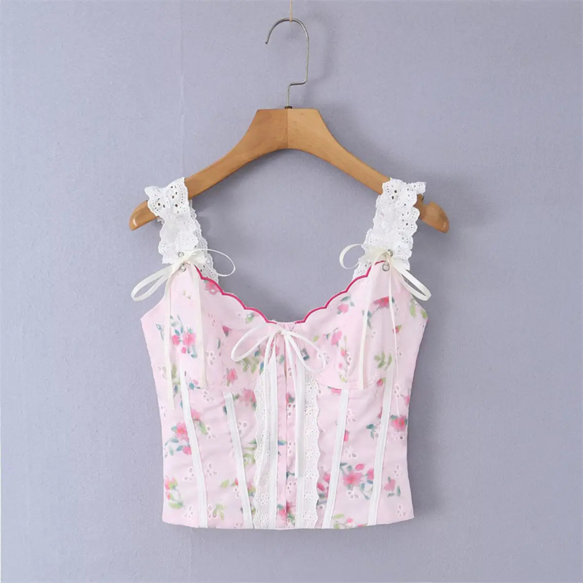 Pink floral lace camisole top, front view on hanger