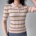 Model wearing pink green stripe ribbed-knit polo top with short sleeves, retro-inspired fitted shirt