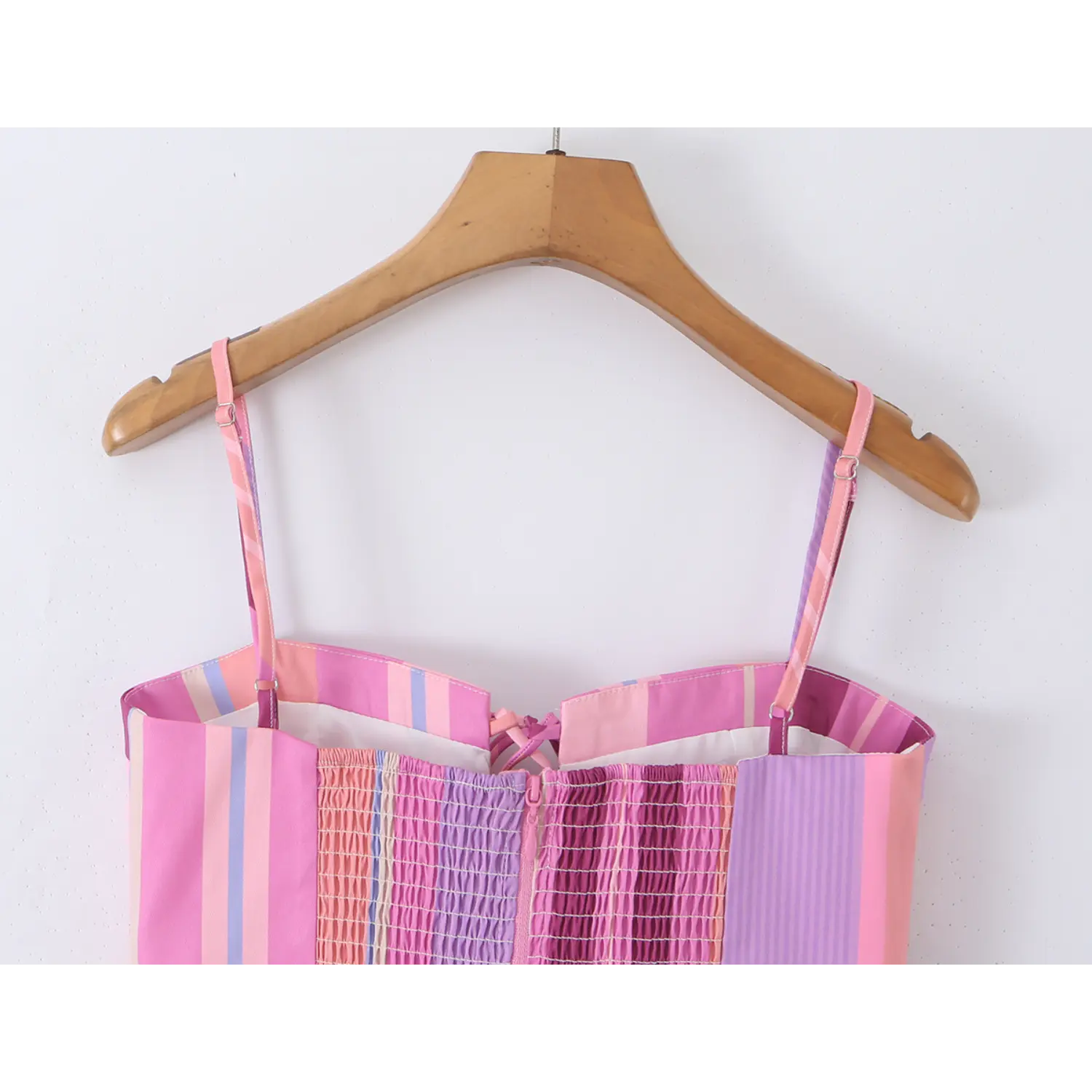 Hanging back full view, adjustable printed spaghetti straps, full elastic smocked back panel and center zipper