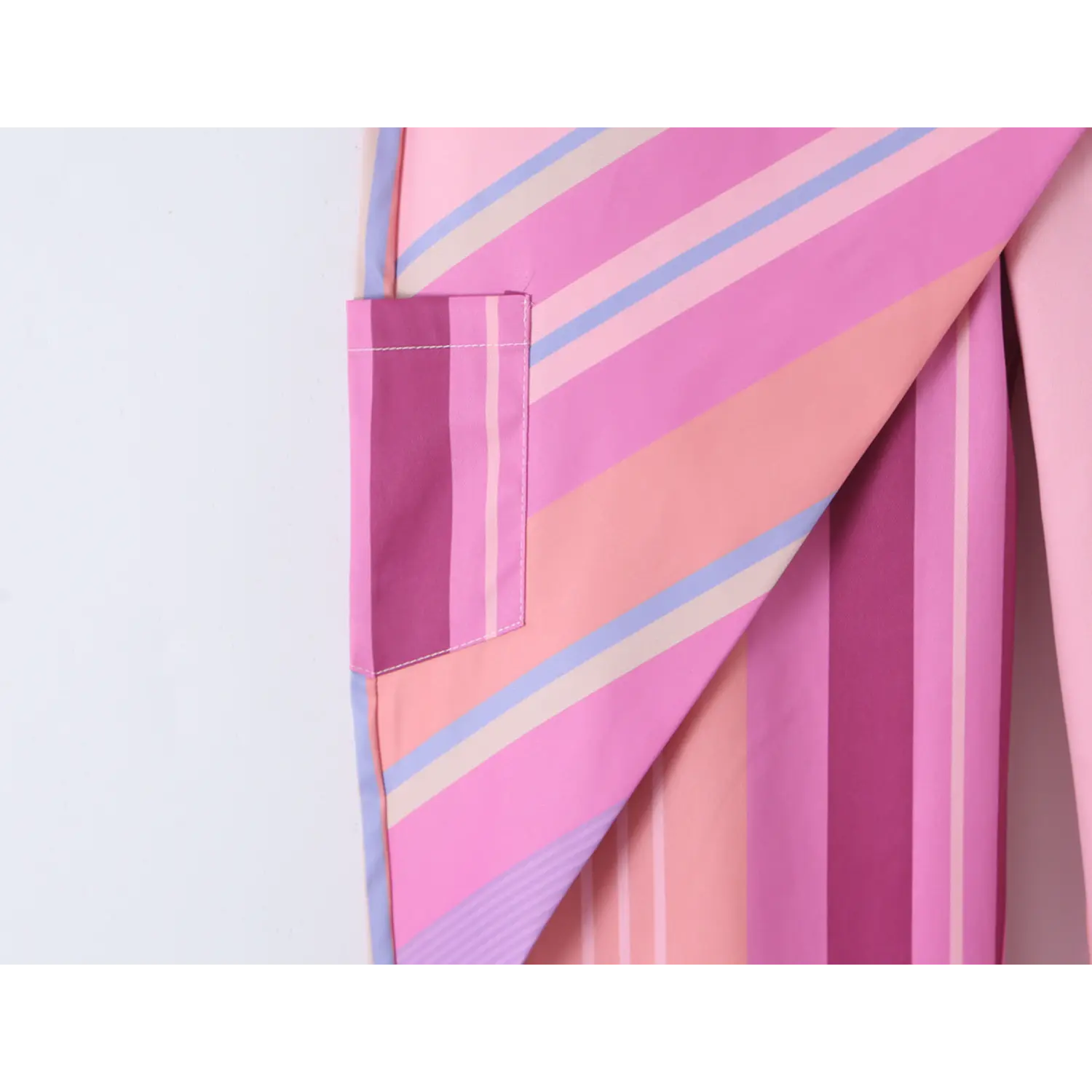 Side cargo patch pocket close-up, matching striped fabric fully lined with double edge stitching