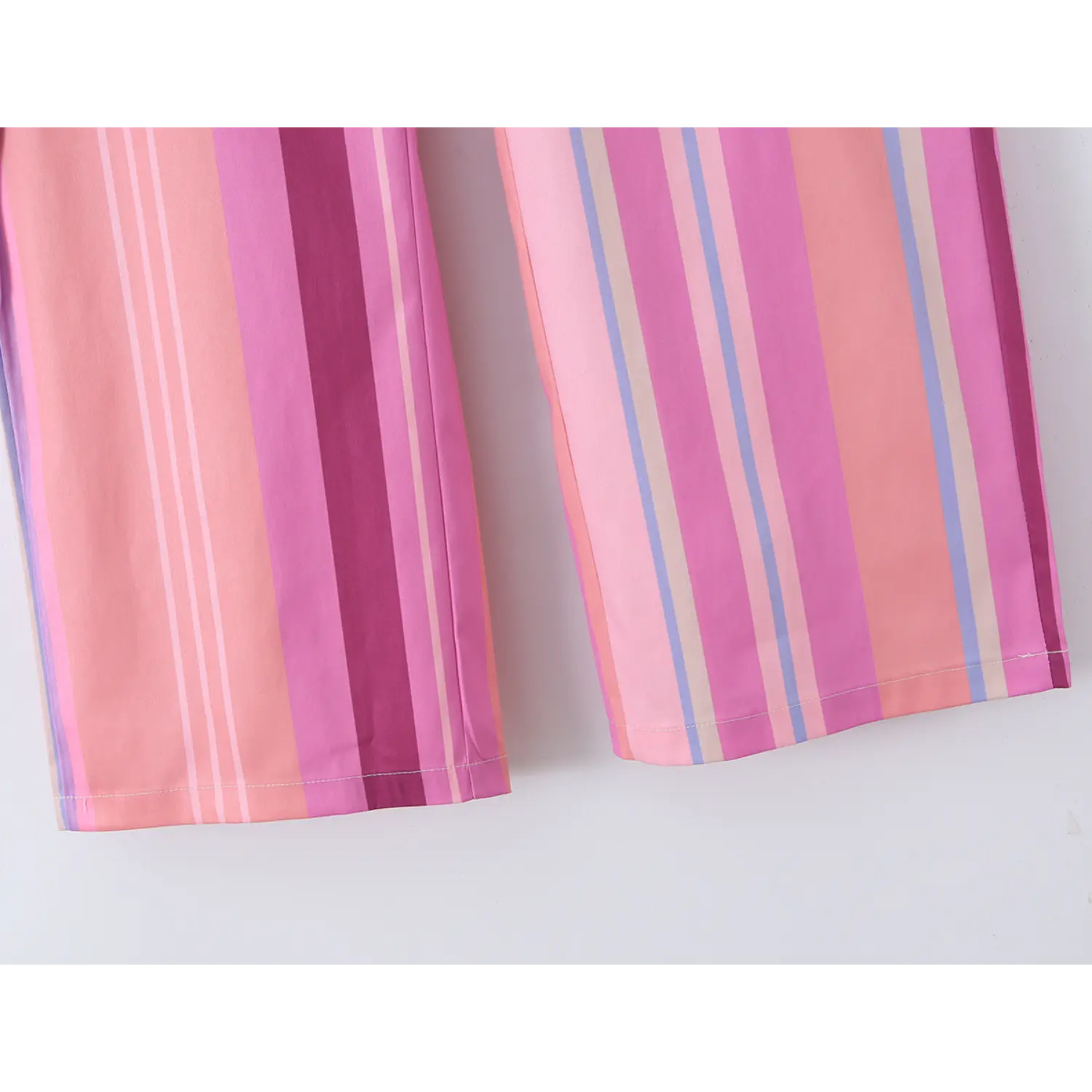Pant leg bottom hem neat double straight stitching, vertical pastel pink purple stripe fabric drape