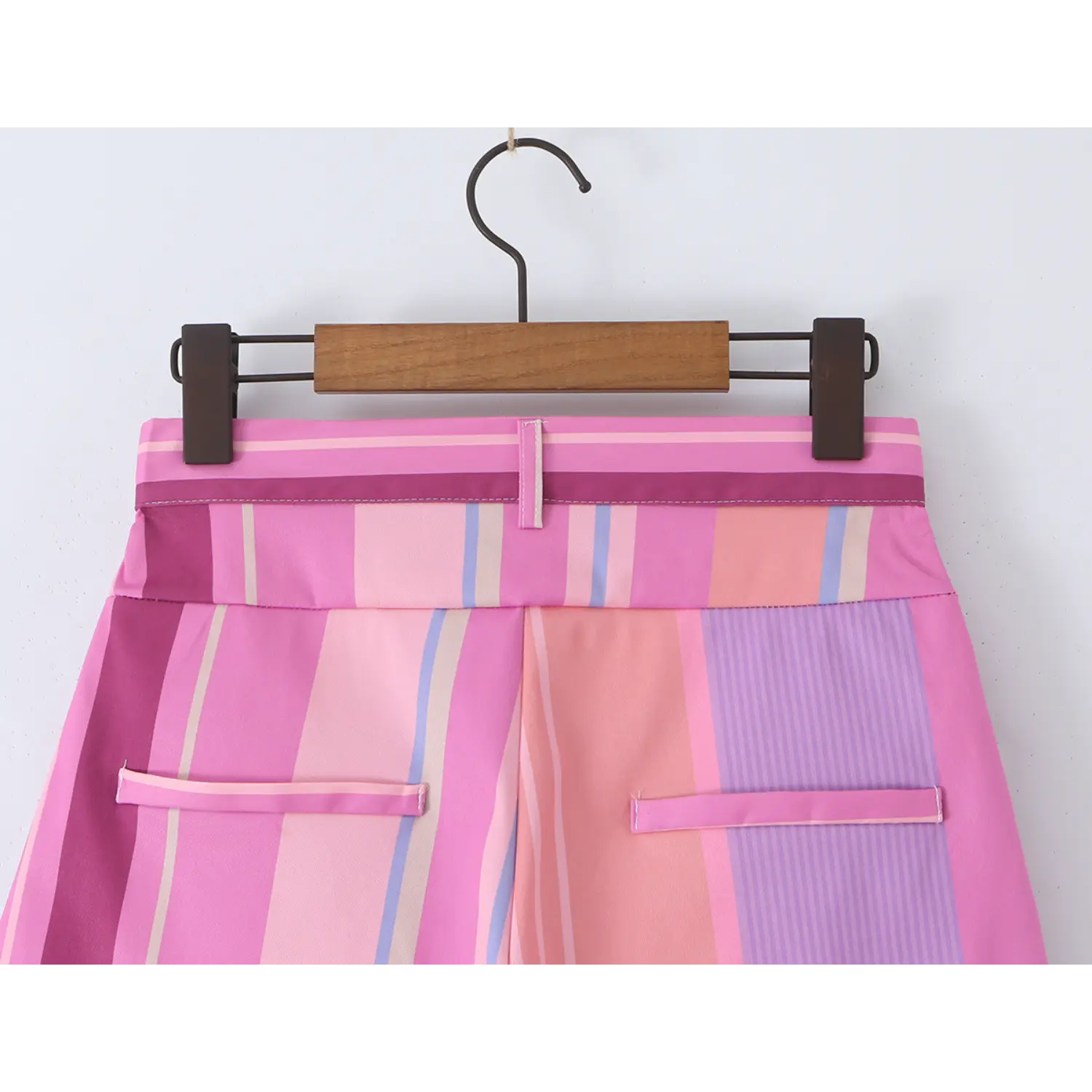 Hanging back waist full view, solid color waistband center belt loop and double back welt pockets