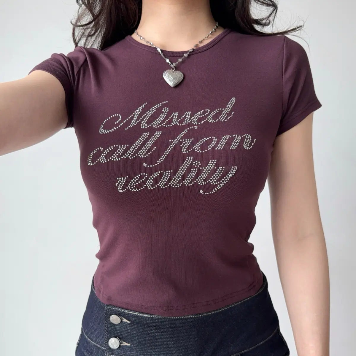 Front view of plum t-shirt showing the script text print, crew neckline, and fitted bodycon fit