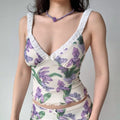 Close-up of model wearing purple iris print mesh cami top