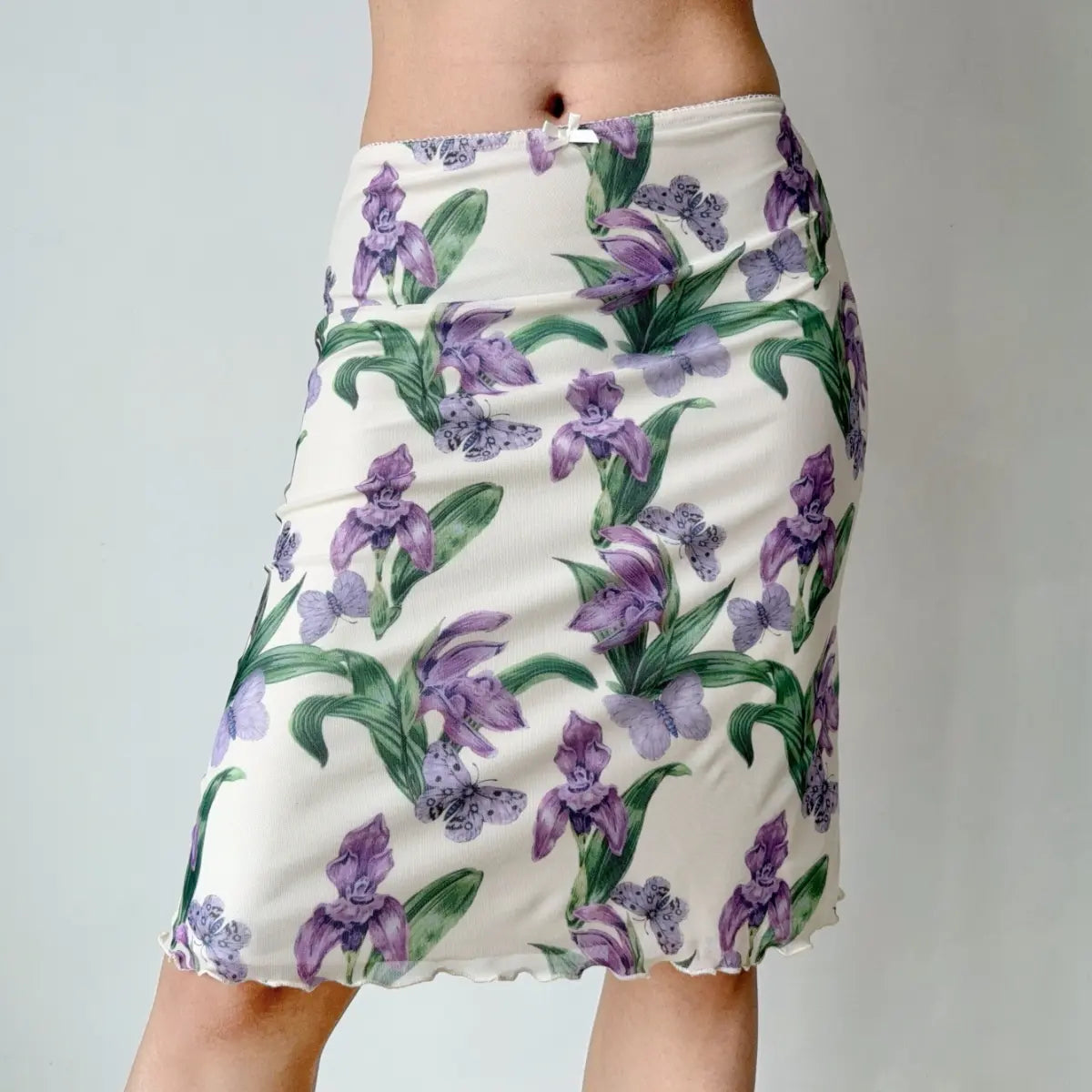 Close-up of model wearing purple iris print mesh midi skirt