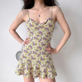 Model wearing purple yellow floral-print cami dress with cowl neck and ruffle hem, flowy summery mini dress