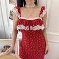 Detail view of red ditsy floral lace-trim maxi dress on model