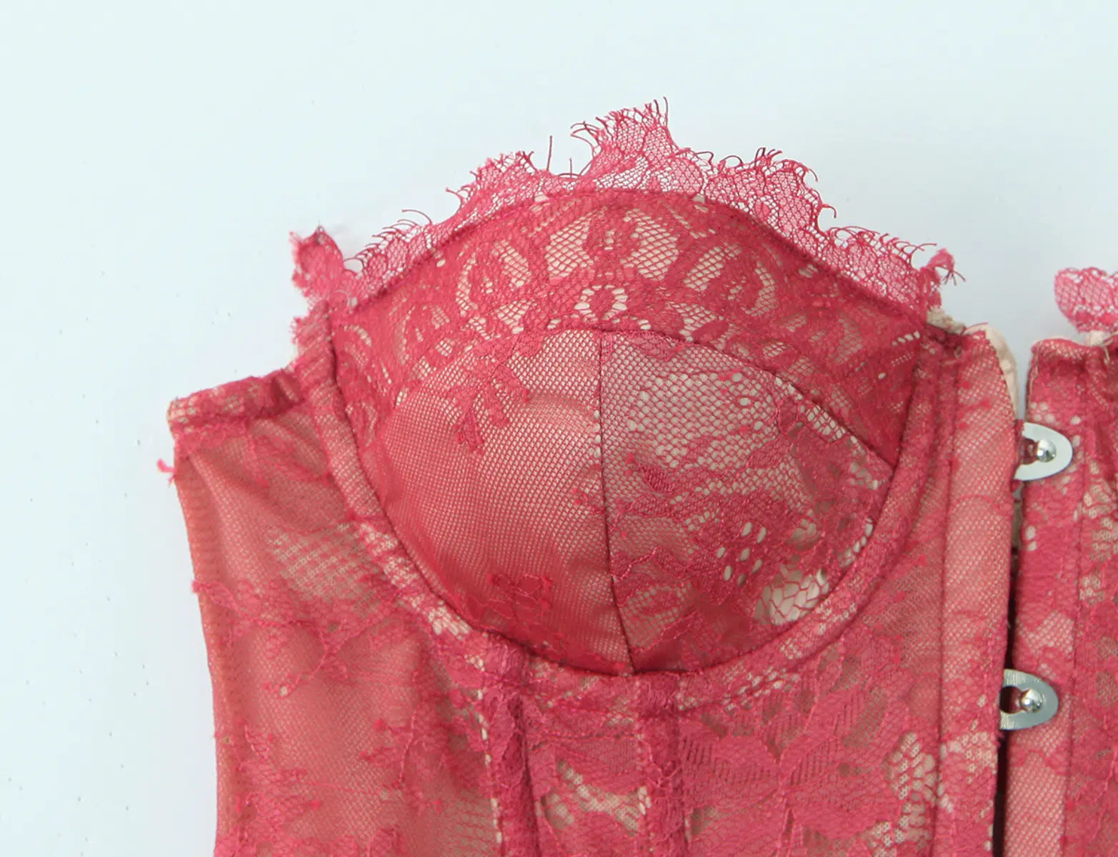 Lace trim detail of red strapless corset top