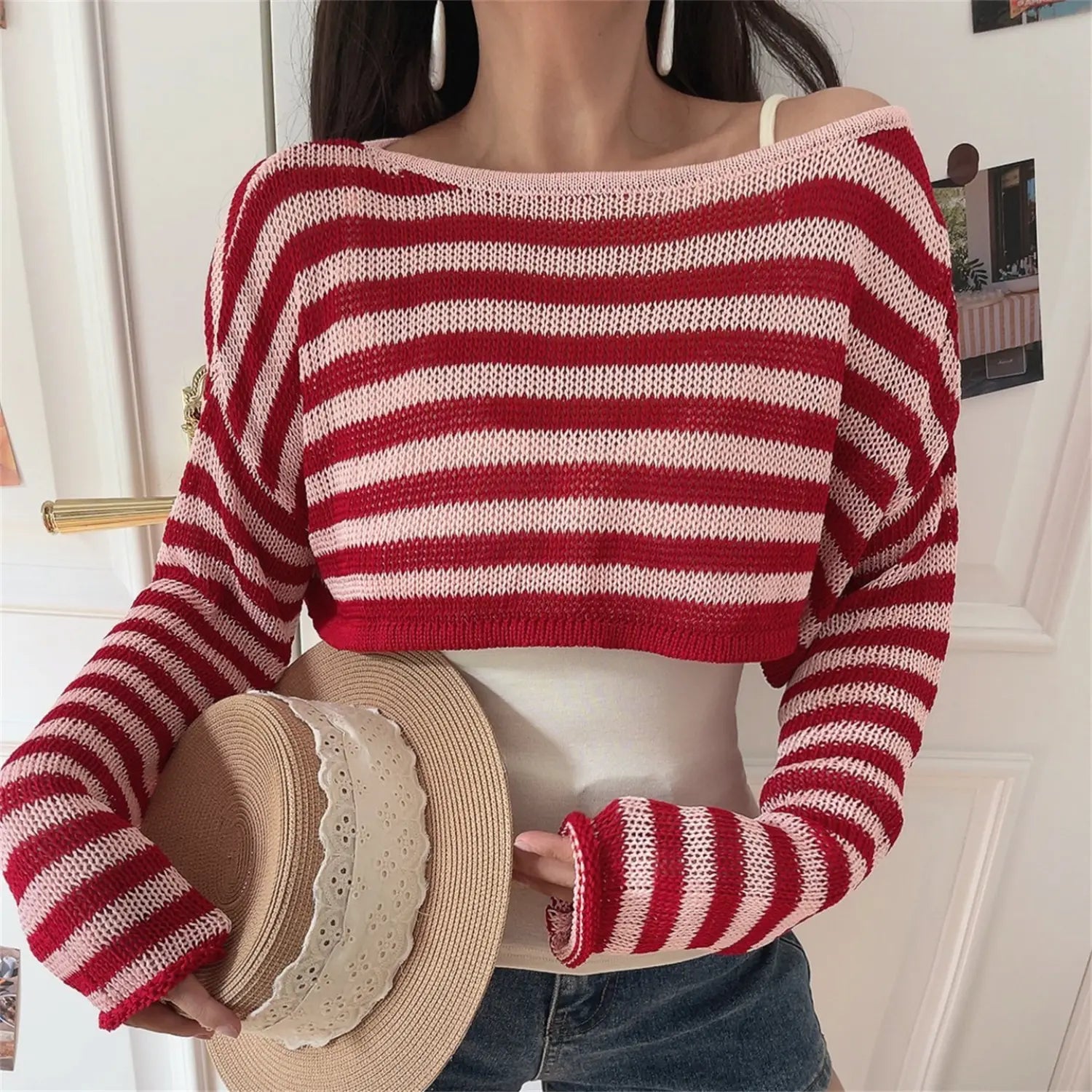 Front lifestyle shot of stripe off shoulder knit cover up, matching striped long sleeves, cropped waist match cami inner top