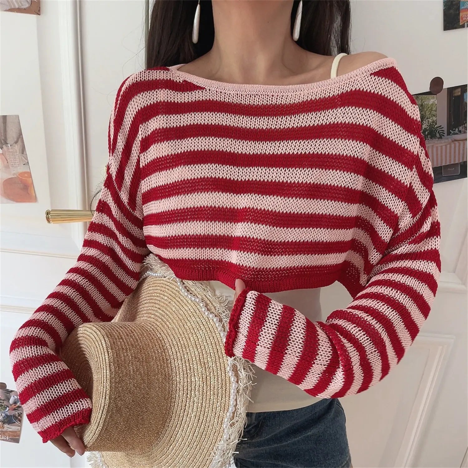 Torso close-up of breathable hollow striped knit fabric, wide boat neck off shoulder design