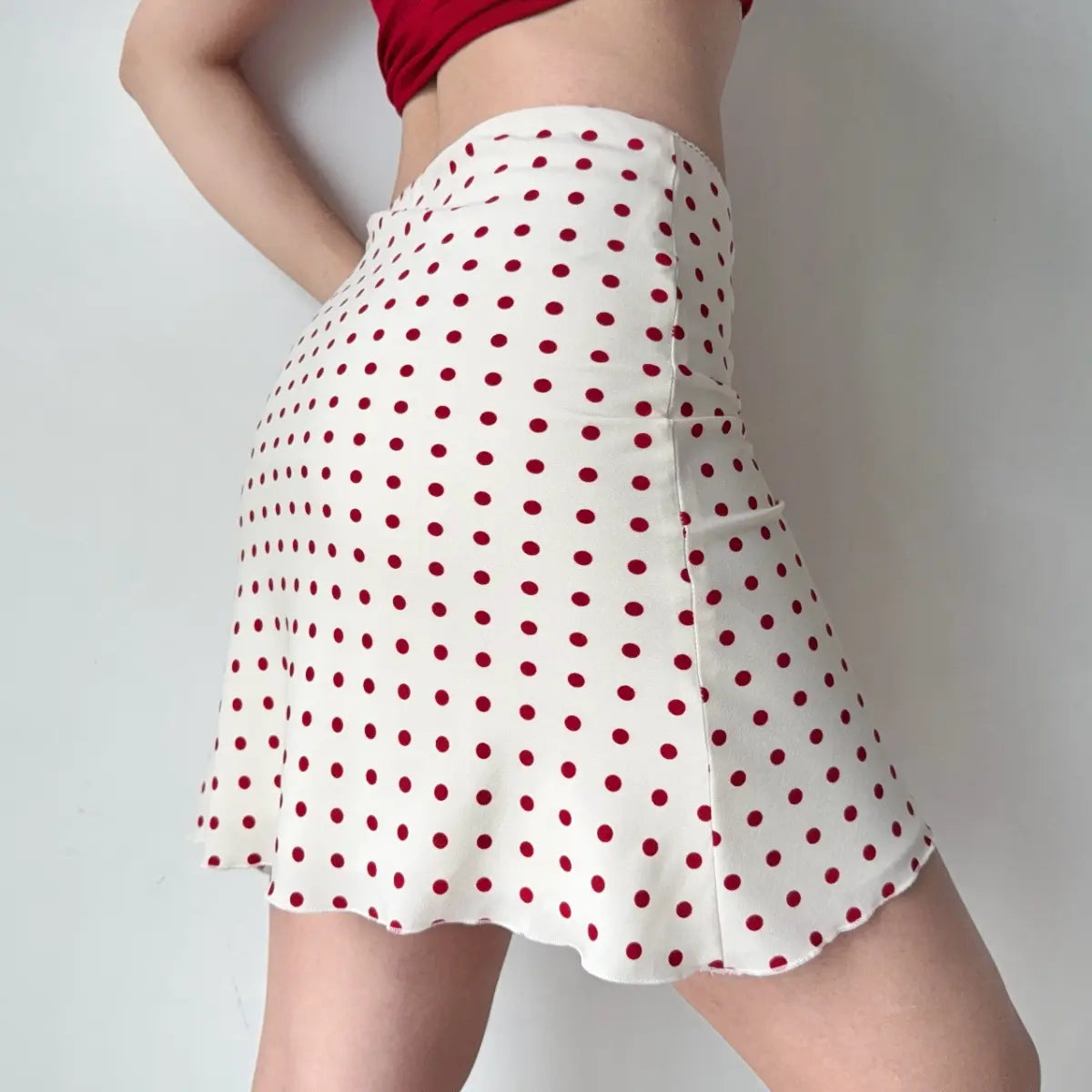 Back view of red polka dot mini skirt