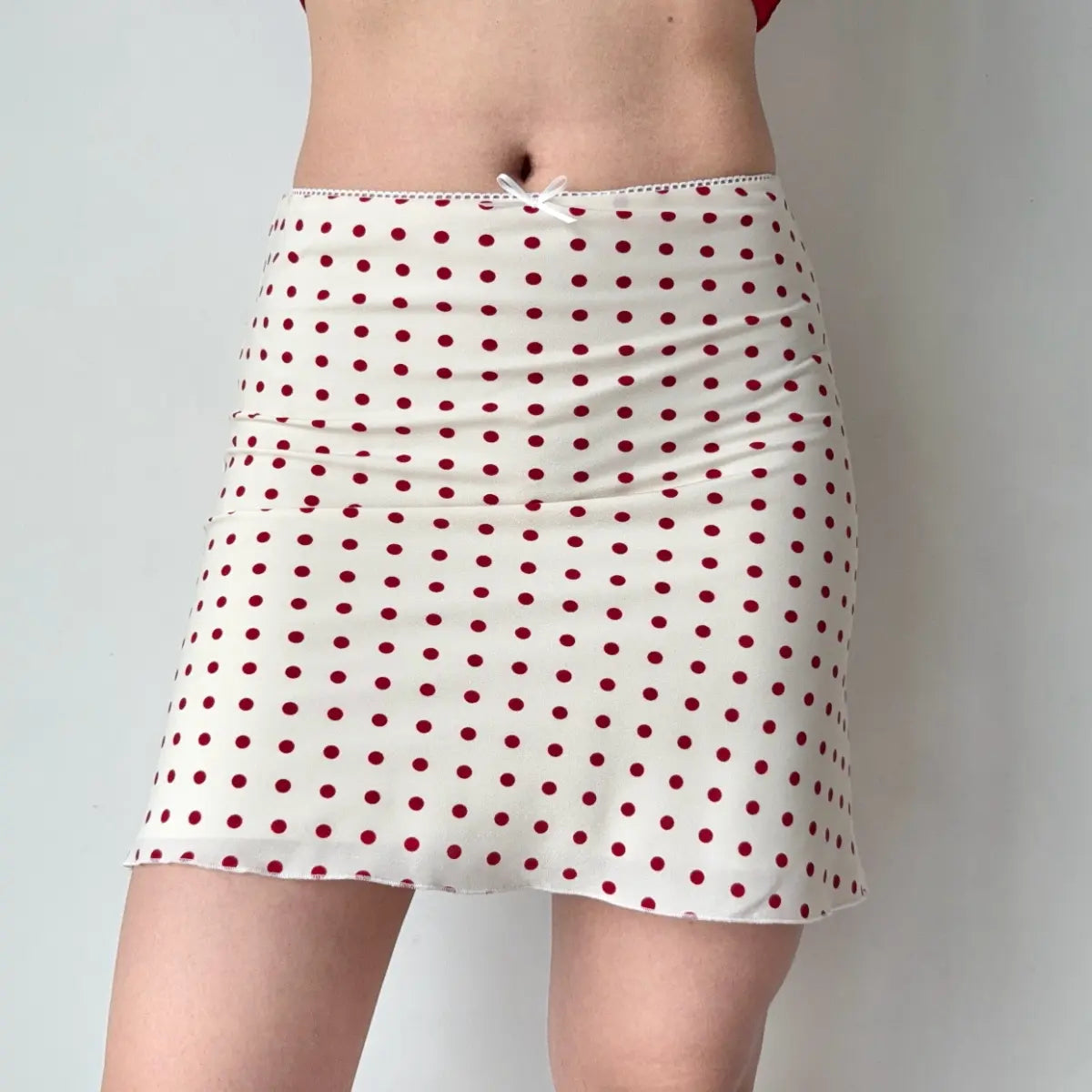 Red polka dot mini skirt, full front view