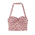 White base strawberry print halter corset top with bust front tie detail, flat lay