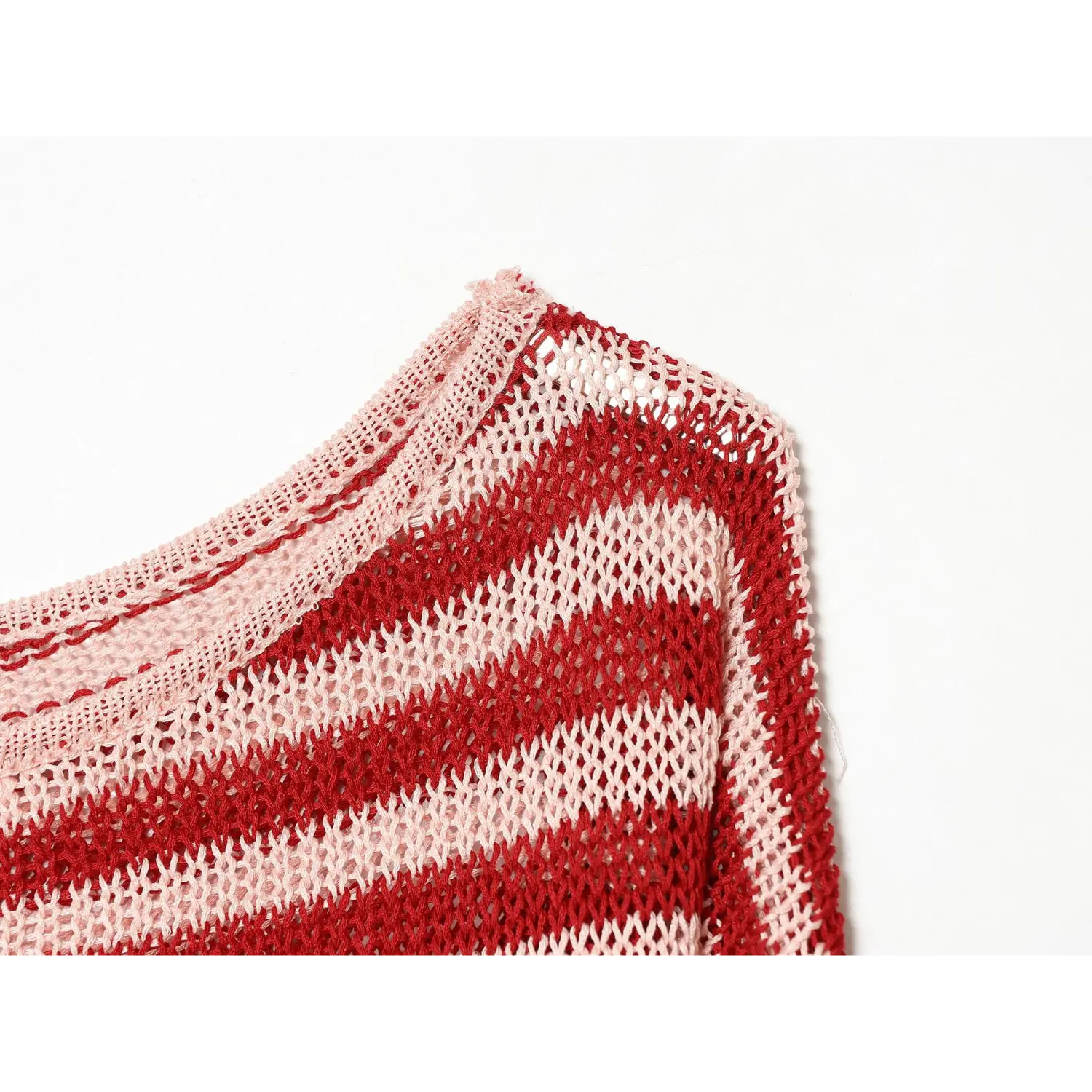 Side neck partial shot, pink ribbed binding edge, open breathable mesh knit construction
