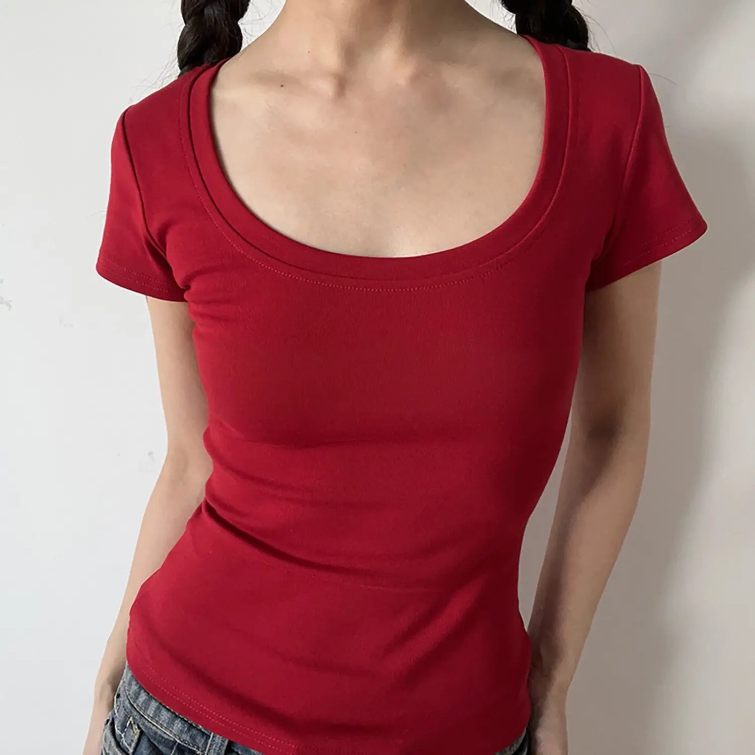 Front view of bright red low U-neck ribbed bodycon short sleeve casual tee