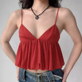 Model wearing red V-neck cami top with flowy chiffon peplum hem, romantic spaghetti-strap blouse